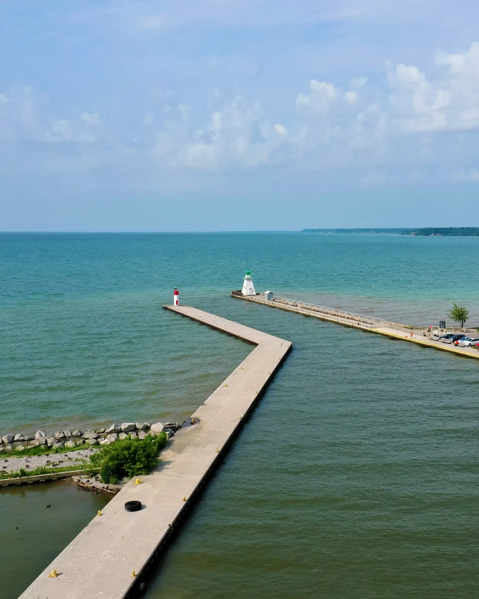 Aerial view of the Port Dover pier and lighthouse reaching into Lake Erie.